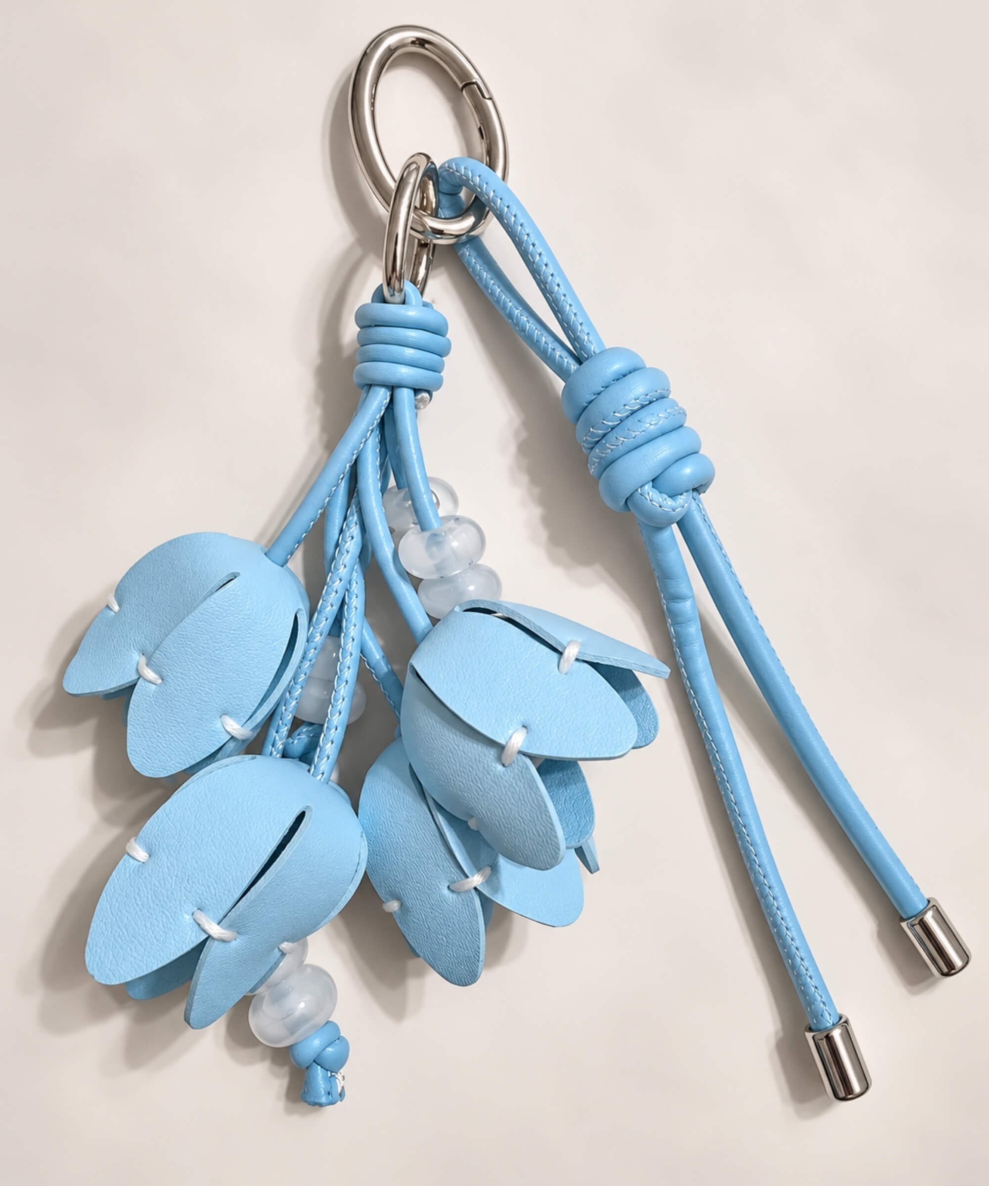 Blue tulip PU leather bag charm keychain with layered flower buds and bead details